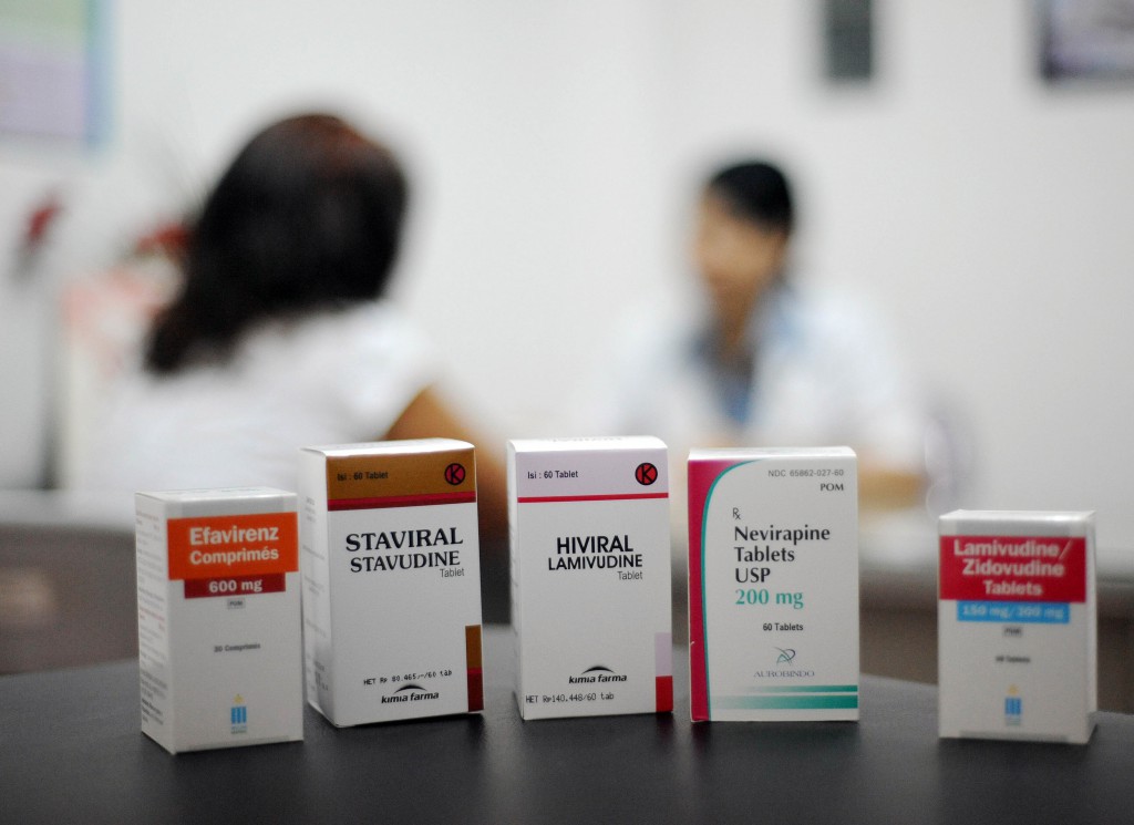 Boxes of antiretroviral medicines sit on